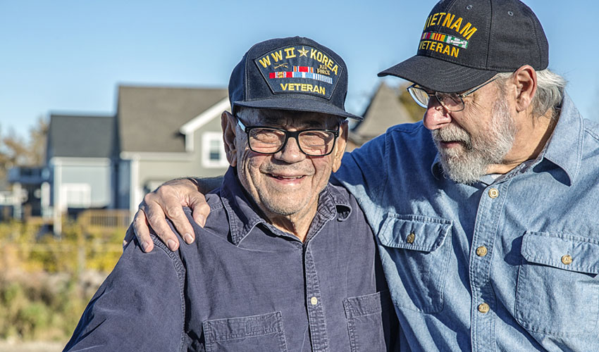 A World War 2 and a Vietnam veteran together on a farm